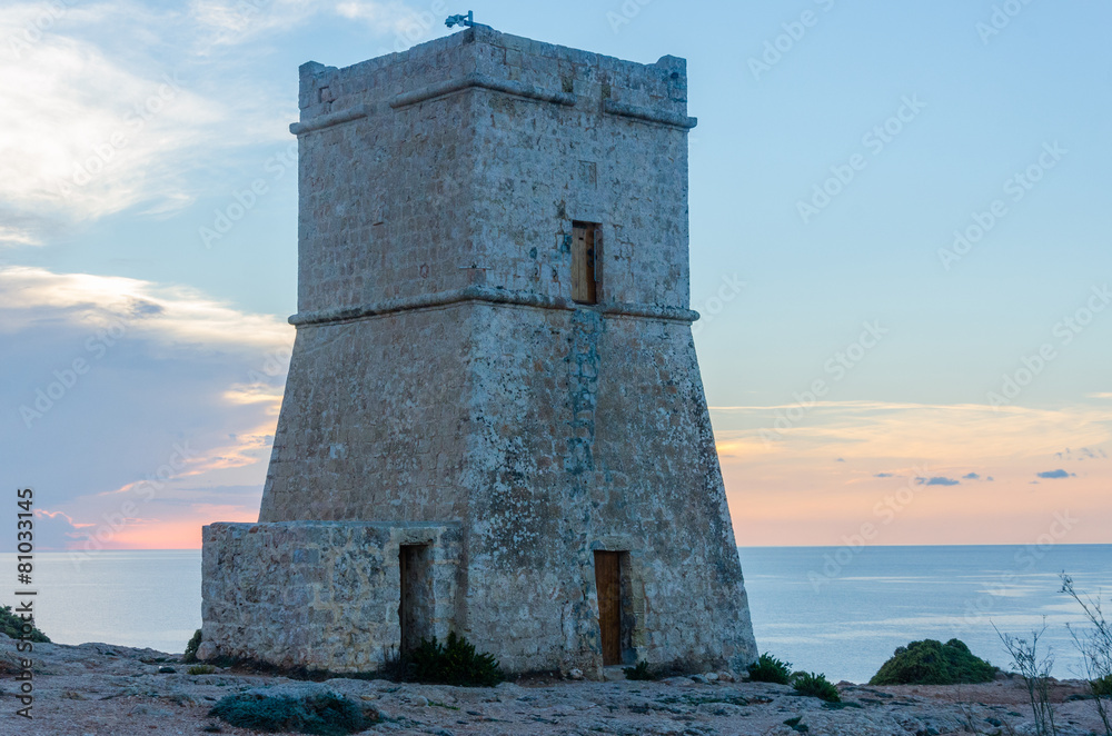 A defense tower next to the Ghajn Tuffieha Bay in Malta A defense tower next to the Ghajn Tuffieha Bay in Malta