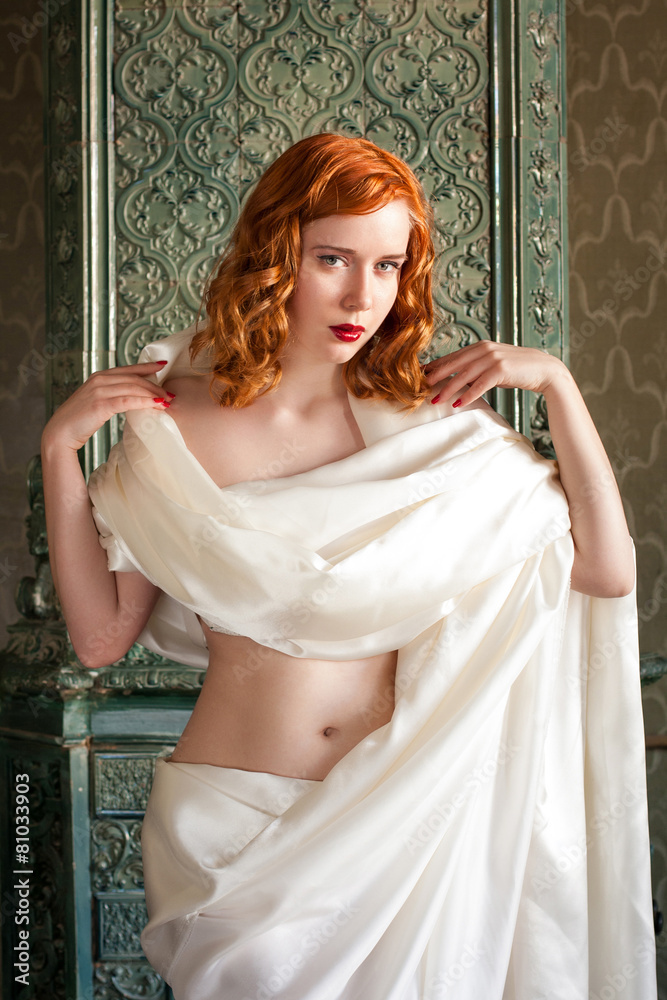 Fototapeta premium Sexy redhead woman in white veil