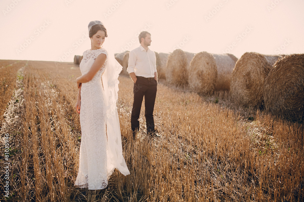happy wedding couple in a field happy wedding couple in a field