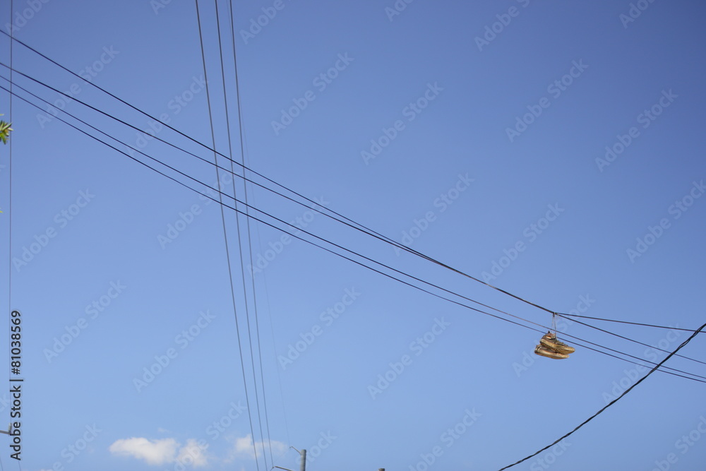 Shoes hanging from power lines
