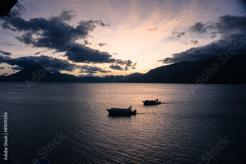 two boats at sunset photo