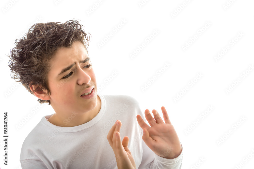 Caucasian smooth-skinned boy holds hands as to reject or remove Caucasian smooth-skinned boy holds hands as to reject or remove
