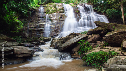 Waterfall in deep rain forest jungle. Mae Tad Waterfall