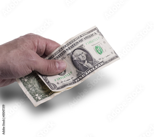 The hand holds dollars