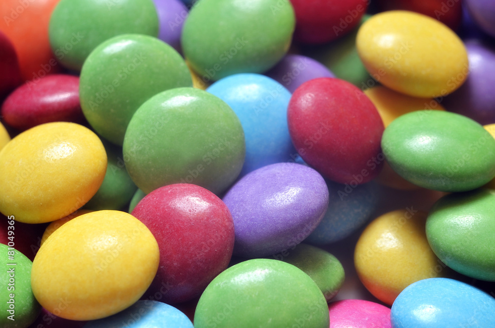 Macro detail of pile of colored smarties Macro detail of pile of colored smarties