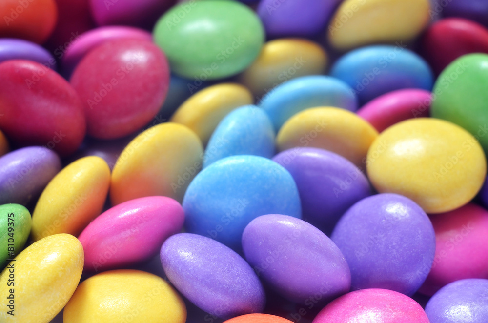 Macro detail of pile of colored smarties Macro detail of pile of colored smarties