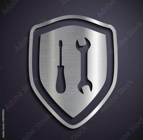 Flat metallic logo shield with tools.
