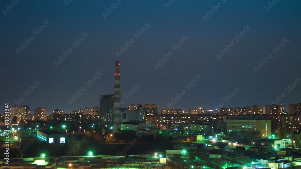 The moon and clouds above night city. Fast time lapse