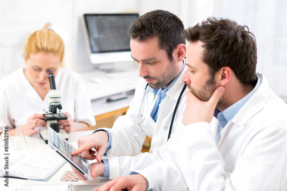 Scientists team working together at the laboratory Scientists team working together at the laboratory