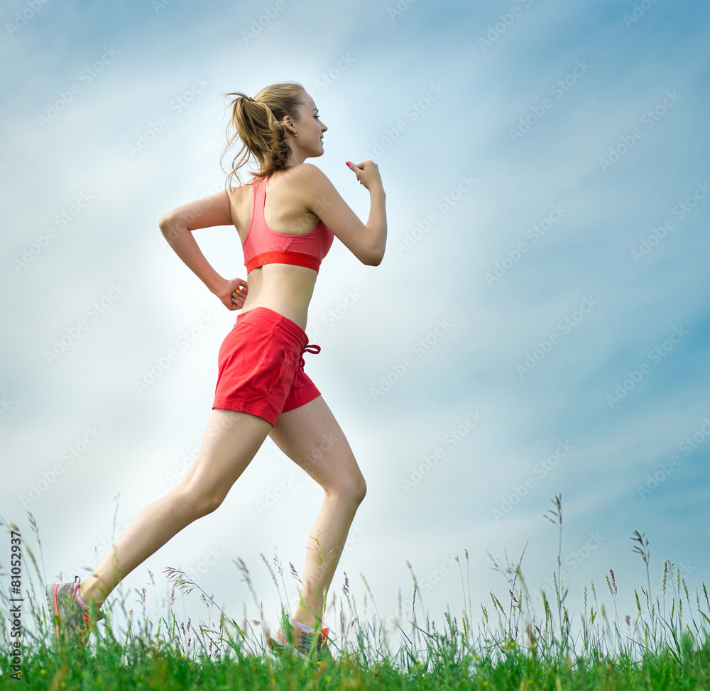 Young woman running summer park rural road. Outdoor exercises. J Young woman running summer park rural road. Outdoor exercises. J