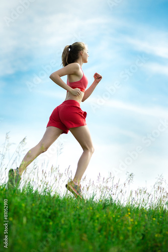 Young woman running summer park rural road. Outdoor exercises. J © mr.markin