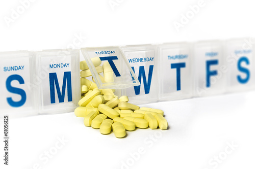 Pills spill out of a dossette box