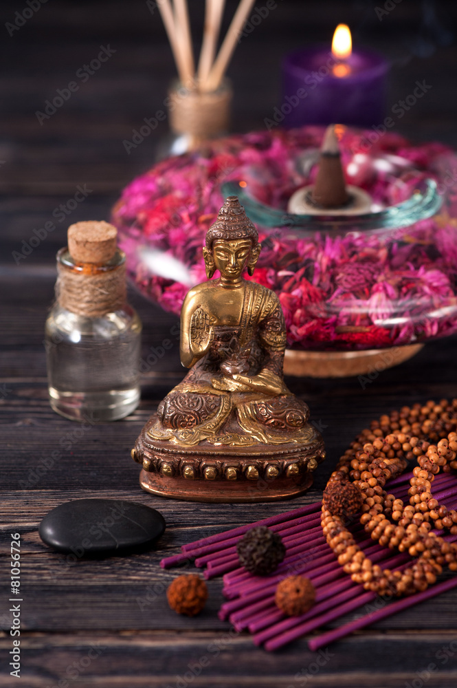 Statue of Buddha, incense and aromatic oils, meditation Statue of Buddha, incense and aromatic oils, meditation