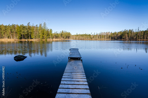 Wooden bridge to the middle of the lake