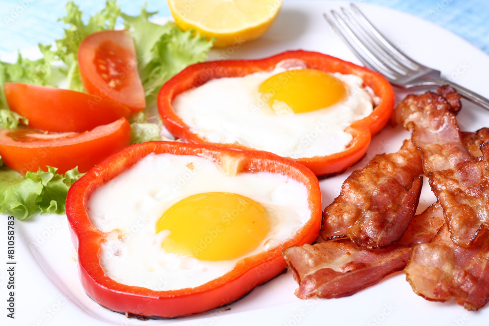 Breakfast fried eggs, bacon, tomatoes and lettuce Breakfast fried eggs, bacon, tomatoes and lettuce