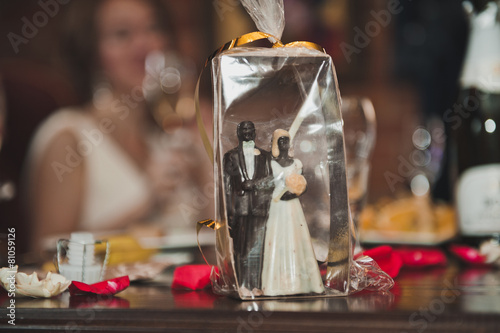 Figures of the groom and the bride on a pie 2102.