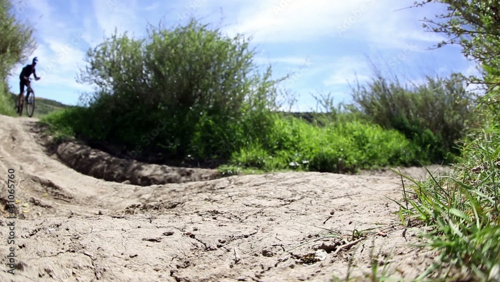 mountain bicycle riding through a country path mountain bicycle riding through a country path