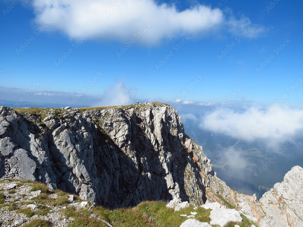 top Australian Alps, high cliffs, white clouds and blue sky