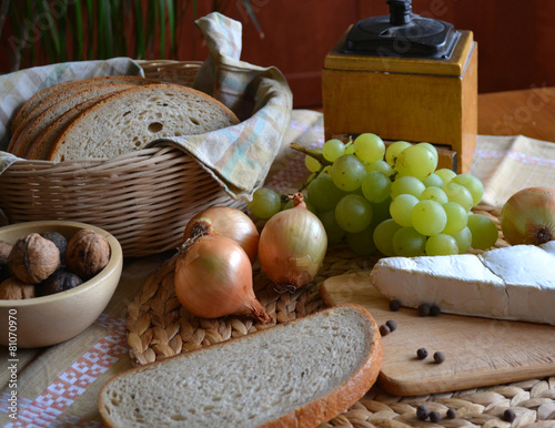 Cheese, bread, onions, wine and grinder