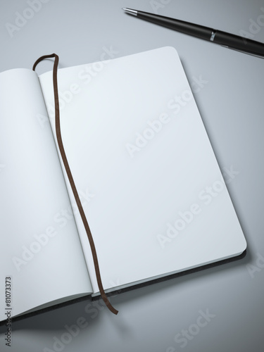 Notebook with clear pages and pen photo