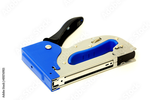 Construction hand-held stapler isolated on white