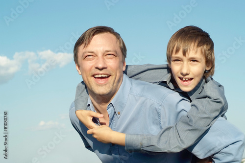 cheerful father and son