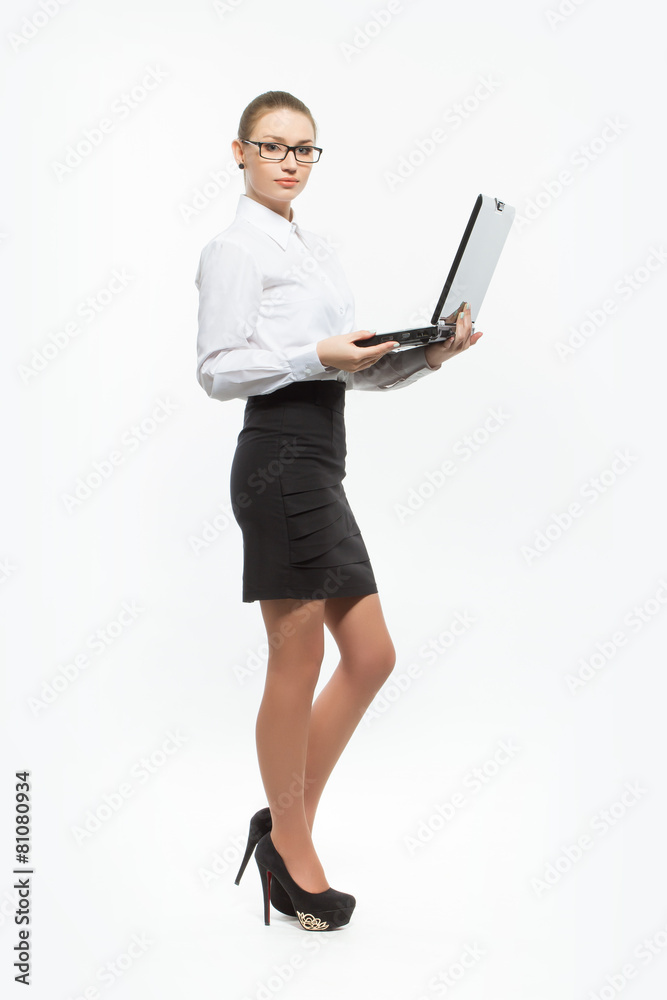 Isolated young business woman with laptop