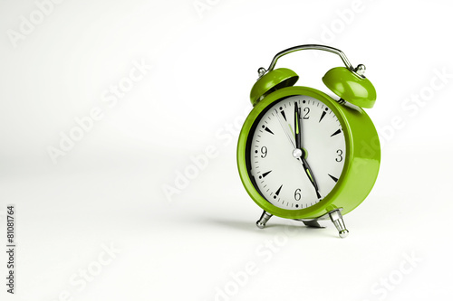 Five o'clock. Green classic clock on white background.