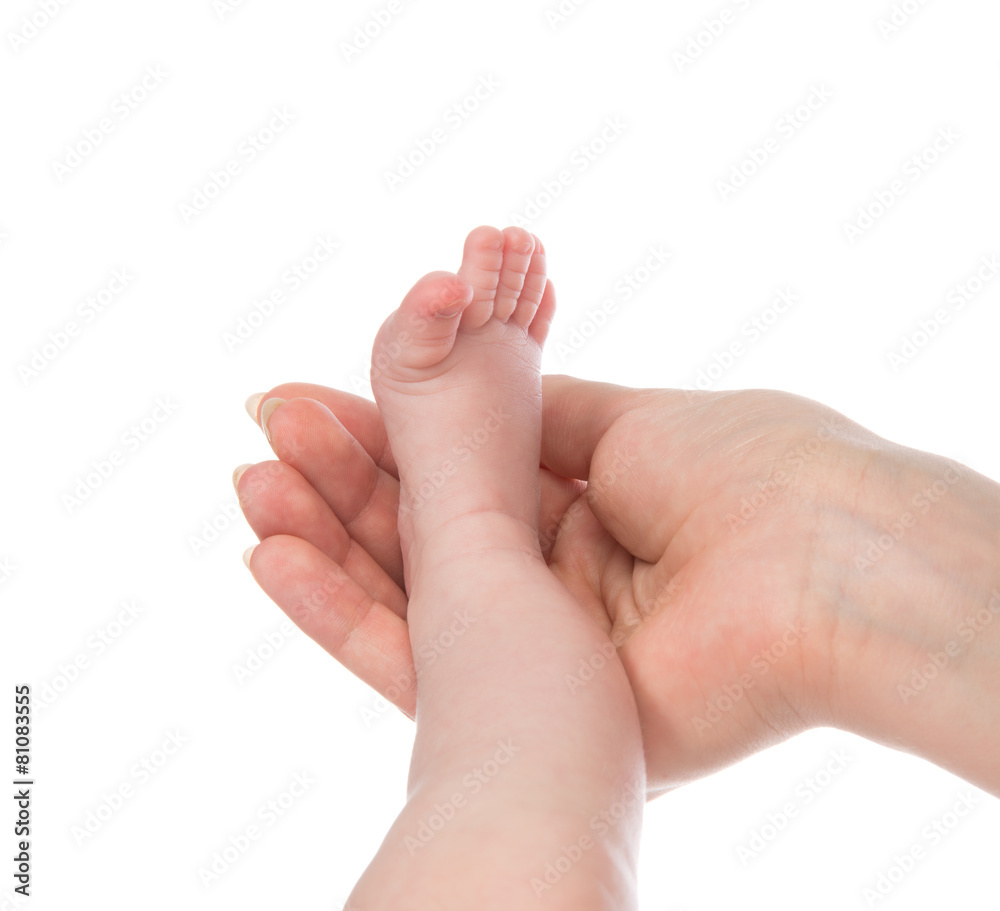 One month new born child baby foot leg in mother hand One month new born child baby foot leg in mother hand
