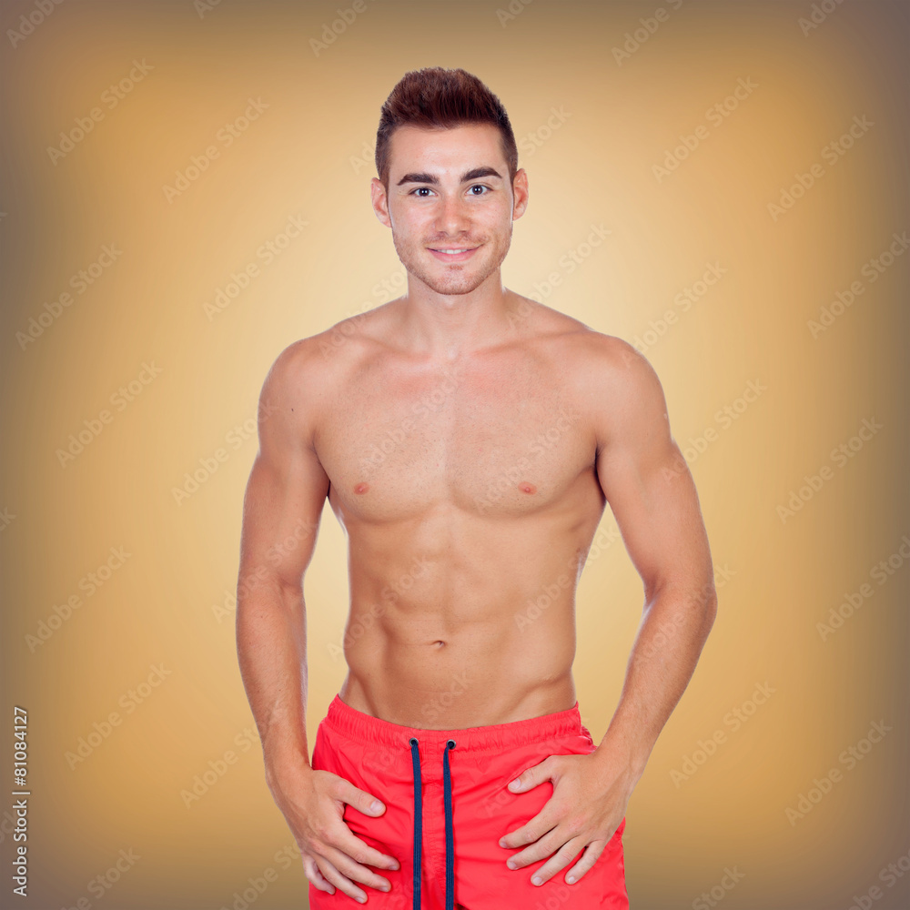 Handsome young man with red swimsuit