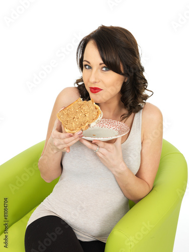 Young Woman Holding Toast with Crunchy Peanut Butter