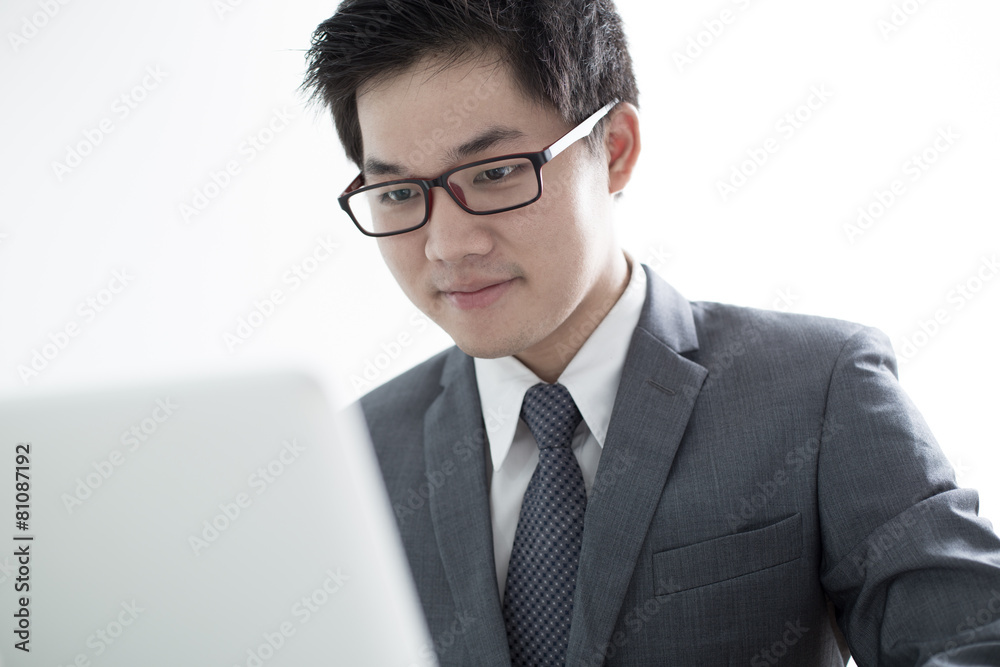 Handsome businessman working with laptop Handsome businessman working with laptop