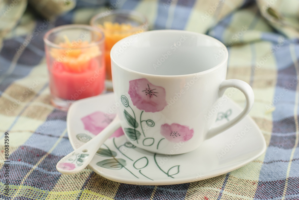 cup of coffee on fabric cup of coffee on fabric