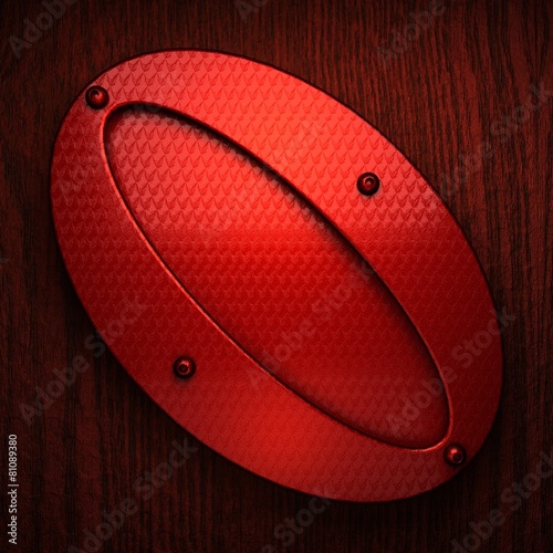 red pollished metal on wooden bachkround photo