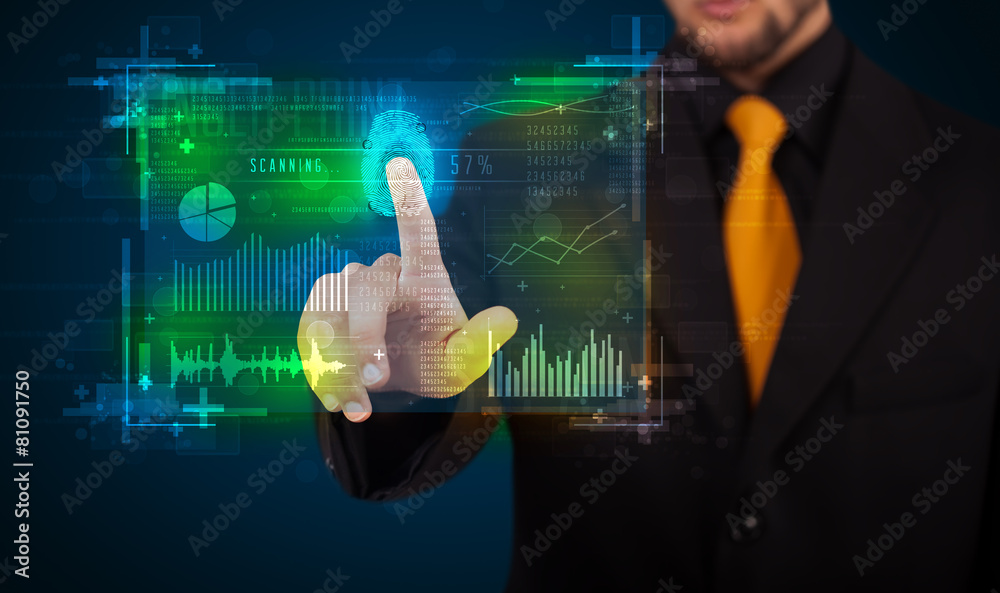 Young businessman pressing modern technology panel with finger p Young businessman pressing modern technology panel with finger p