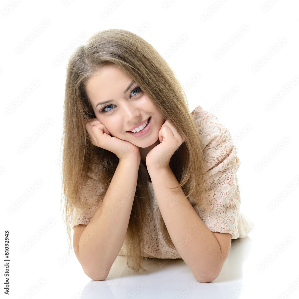 Beautiful happy blond girl lying and looking at camera. Isolated Beautiful happy blond girl lying and looking at camera. Isolated