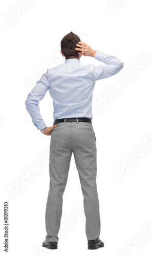 businessman scratching his head from back photo