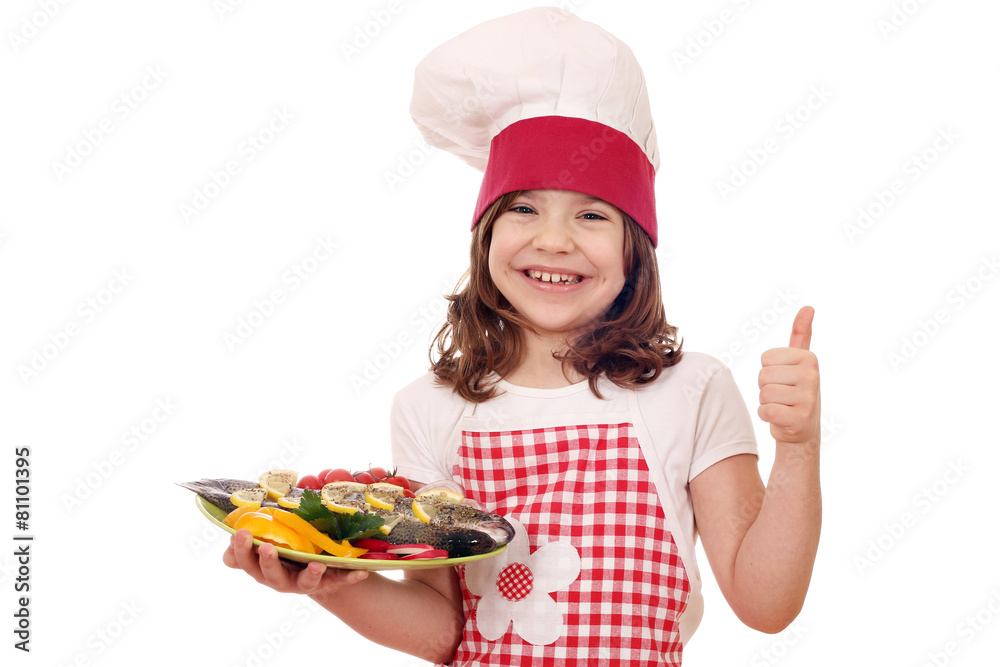 happy little girl cook with prepared trout and thumb up happy little girl cook with prepared trout and thumb up