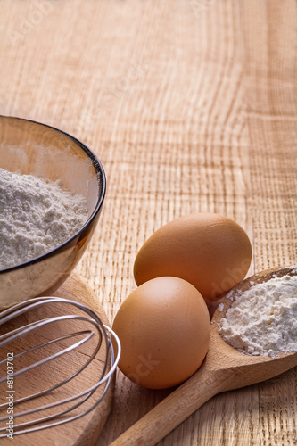 organized copyspace flour in bowl and spoon eggs corolla on vint