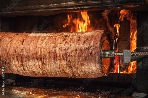 Turkish doner kebab is preparing in an oven with open fire