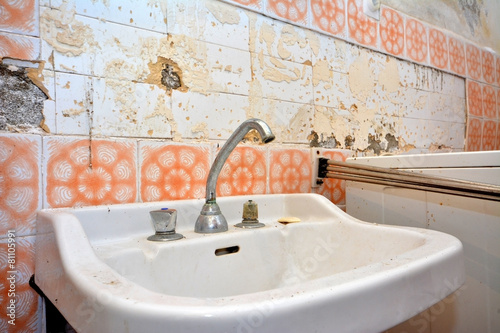 old lavatory in destroyed bathroom