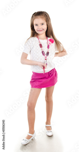 Smiling adorable little girl in skirt with beads