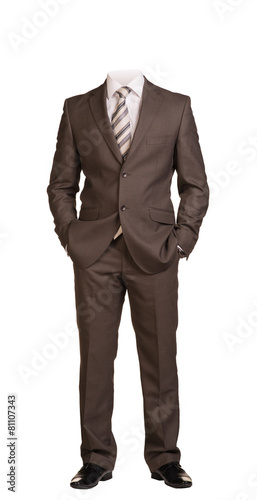 Businessman without head, standing with hands in pockets