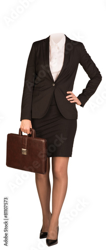 Businesswoman in suit without head, standing and holding