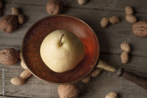 pear with apples on a brown background