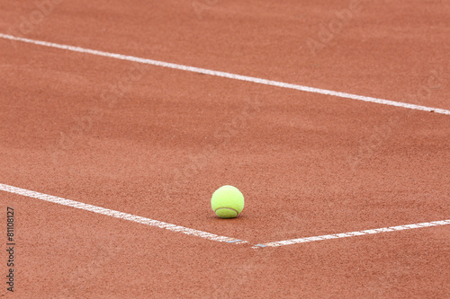 tennis ball on the court © AlexZlat