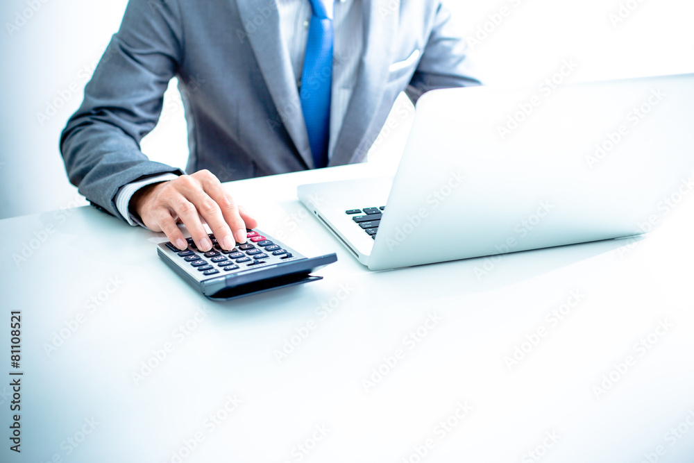 Closeup of businessman hands typing on laptop computer Closeup of businessman hands typing on laptop computer