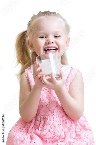 happy child drinking milk o...