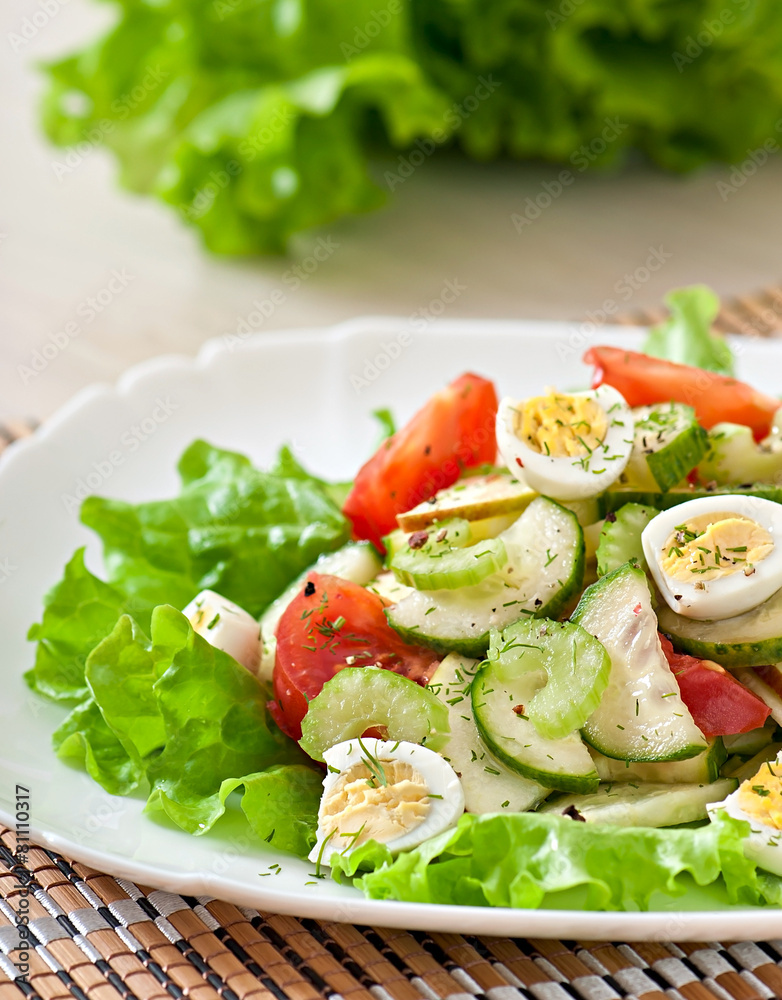 Salad of tomatoes, cucumbers and quail eggs Salad of tomatoes, cucumbers and quail eggs