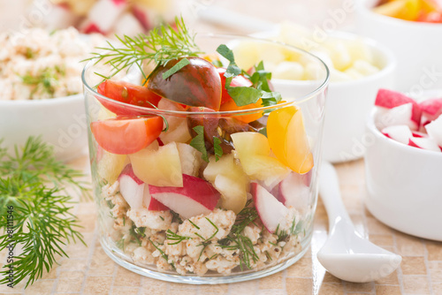 salad with fresh vegetables and cottage cheese in a glass
